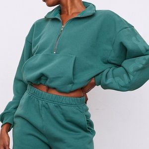 Set Active Half-Zip in colour ‘Tiki’. Size M